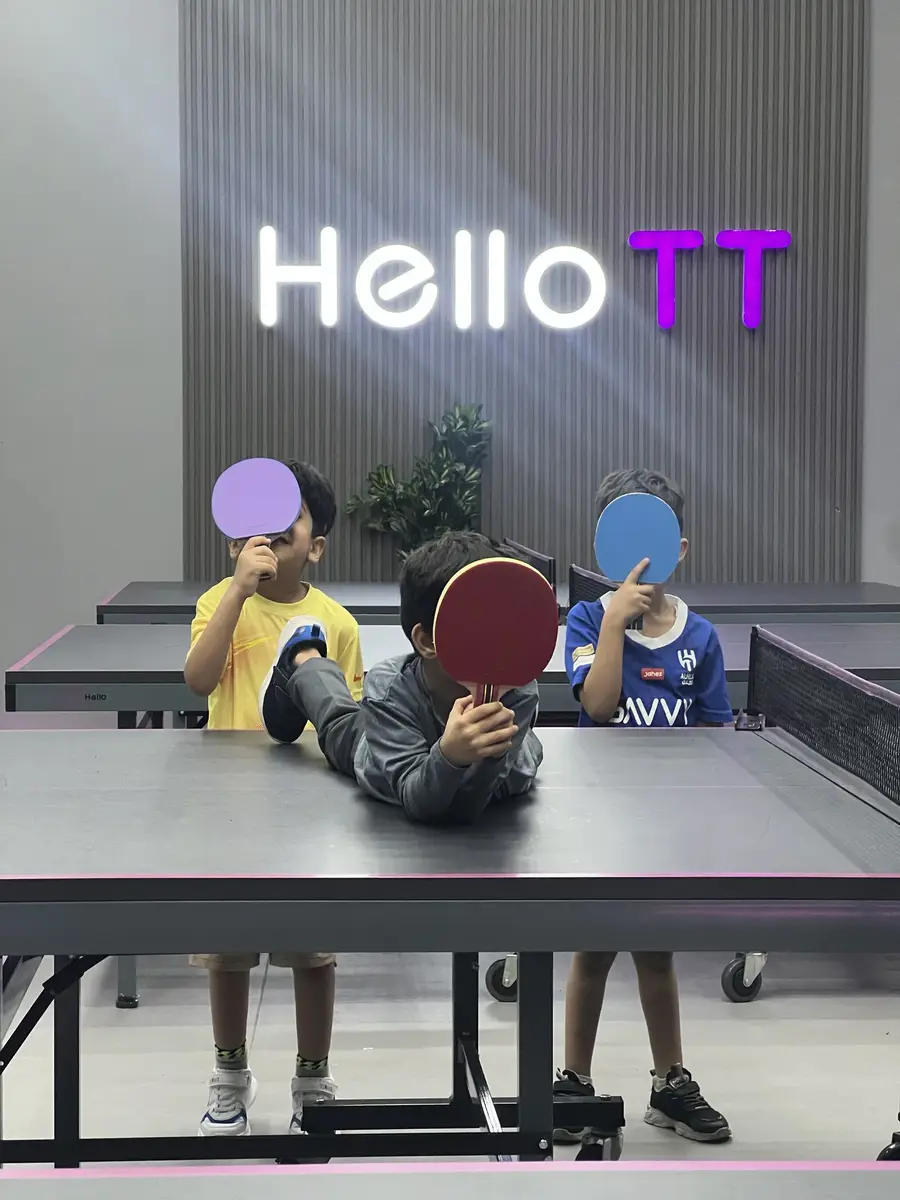 Friends enjoying recreational table tennis at HelloTT